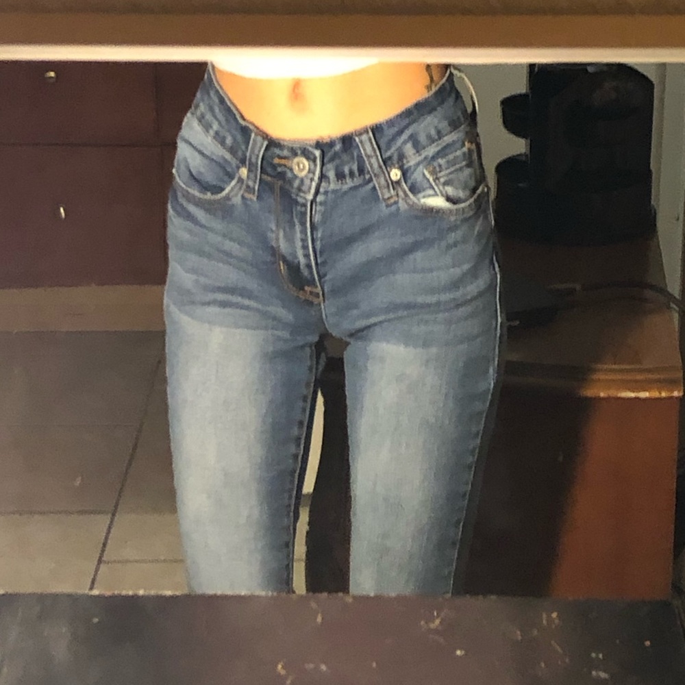 Cropped & frayed blue jeans